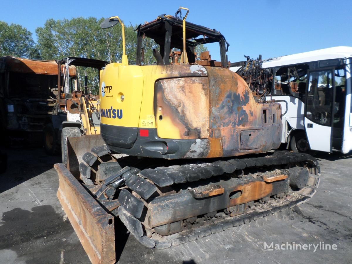 damaged Komatsu PC118MR-8 bulldozer