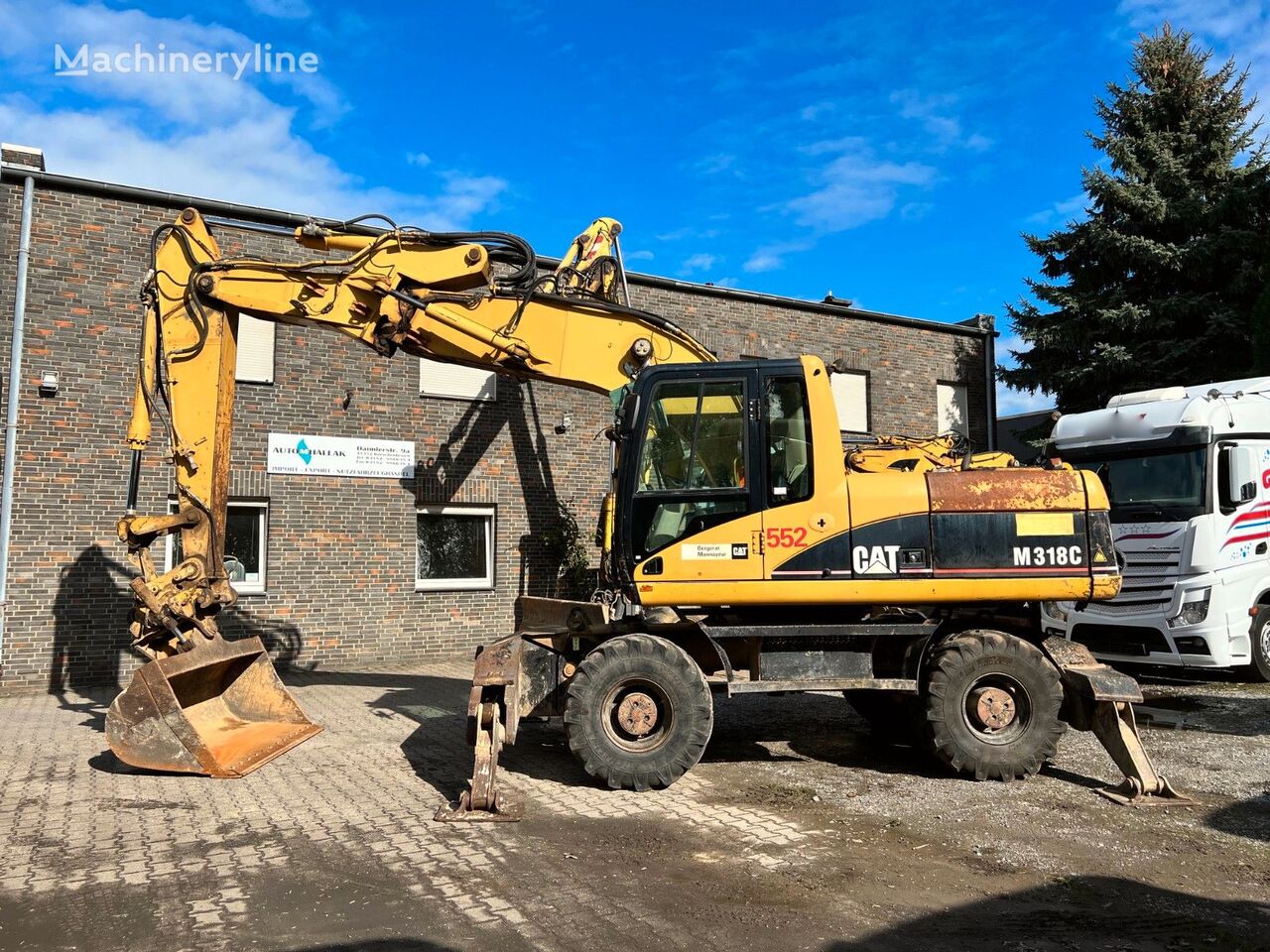 Caterpillar M 318 wheel excavator