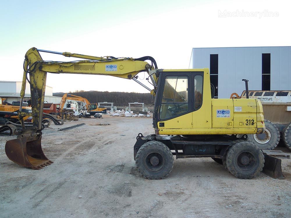 Caterpillar M312 wheel excavator