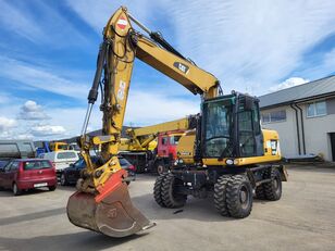 Caterpillar M313D 4X4 wheel excavator